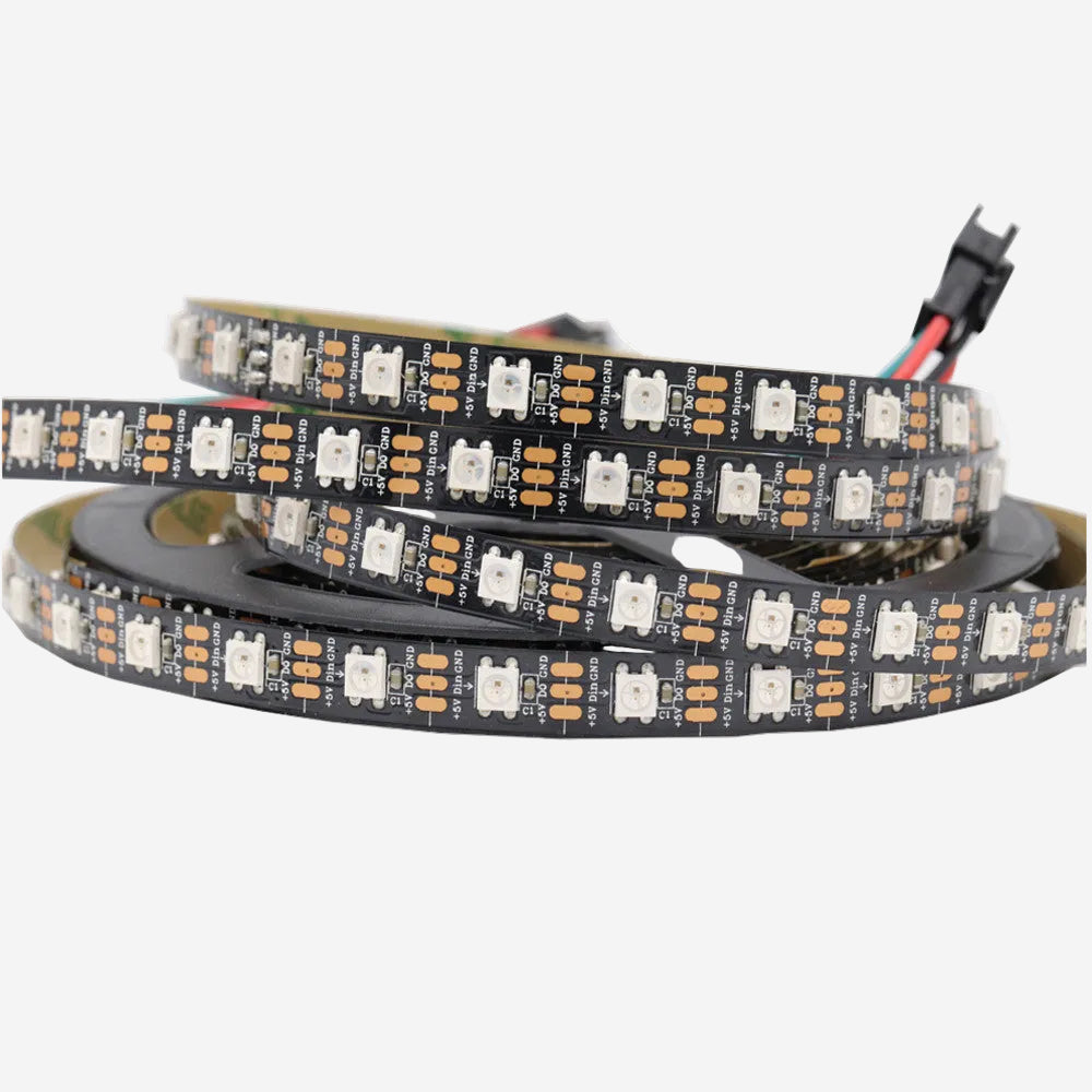 A coiled LED strip light with black casing and multicolor LEDs, featuring a connector plug.