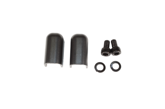A set of black battery input terminal covers, screws, and washers against a white background